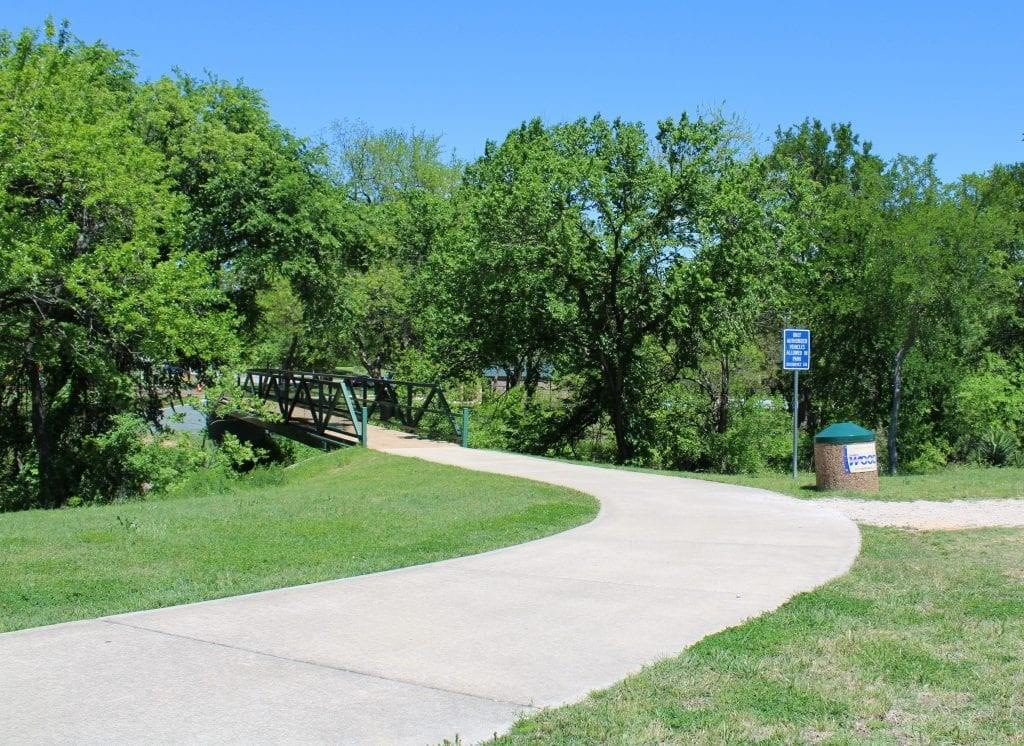 208 Lovers Path Drive Springtown, TX 76082 - Photo 32 of 35 a view of a garden with a house in the background