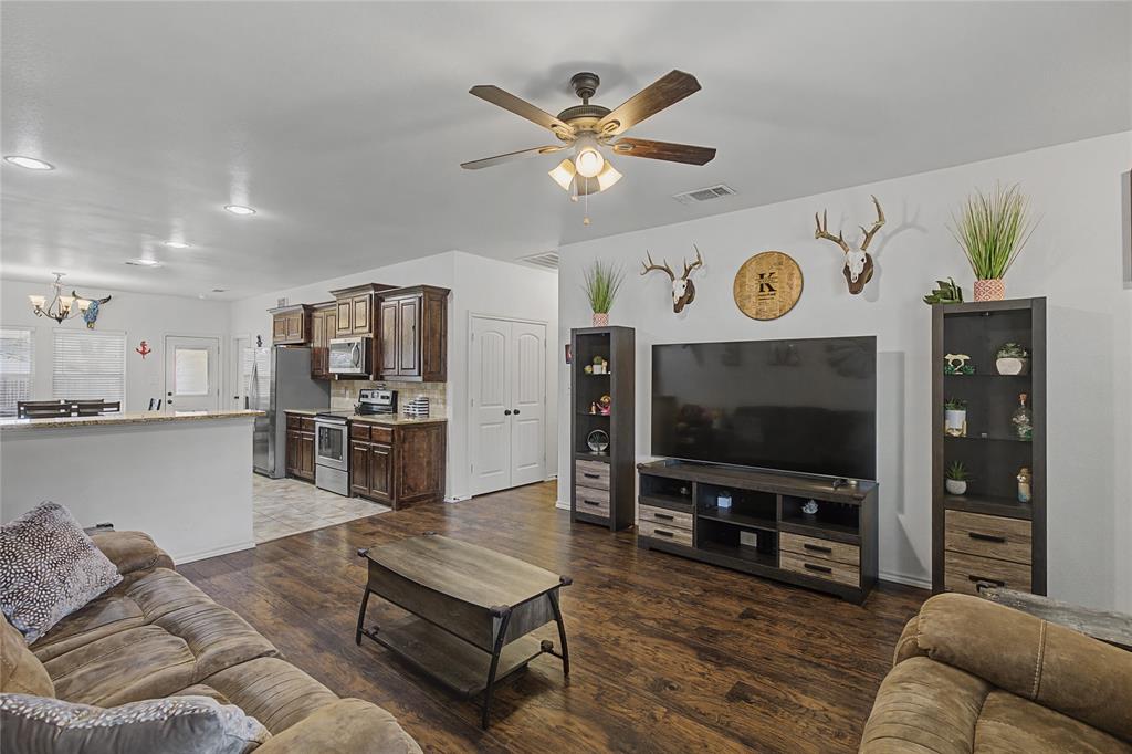 208 Lovers Path Drive Springtown, TX 76082 - Photo 8 of 35 a living room with furniture and kitchen view
