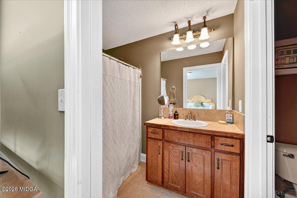 518 River Overlook Forsyth, GA 31029 - Photo 29 of 96 a bathroom with a sink and a mirror