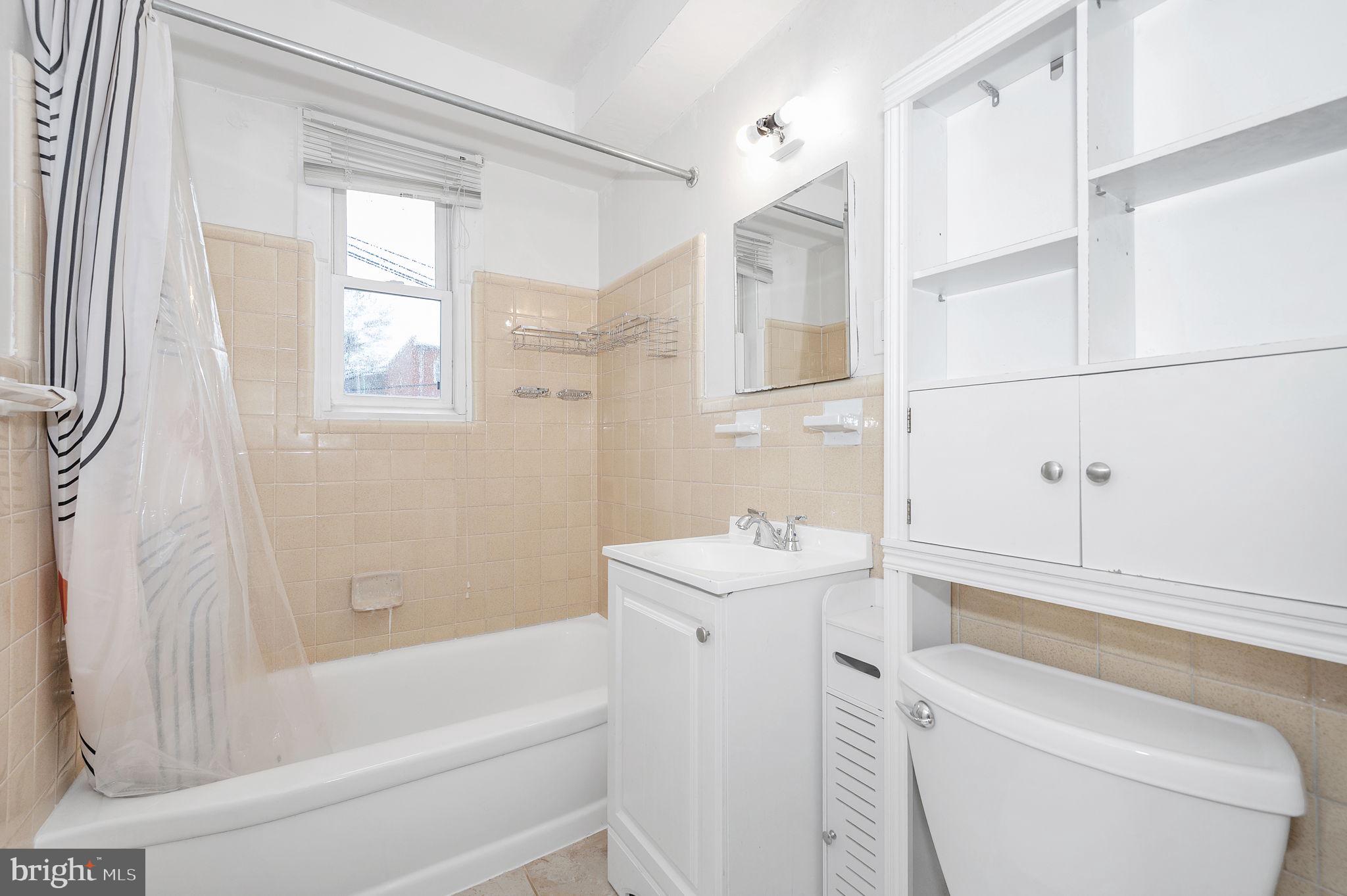 109 Webster Street Northeast Washington, DC 20011 - Photo 25 of 35 a bathroom with a sink a toilet and a bathtub