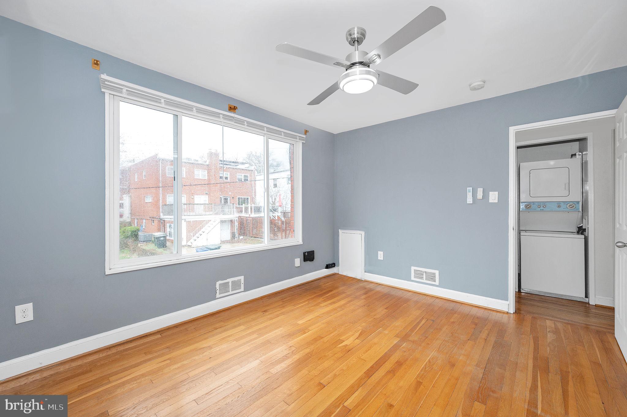 109 Webster Street Northeast Washington, DC 20011 - Photo 3 of 35 a view of an empty room with wooden floor and a window