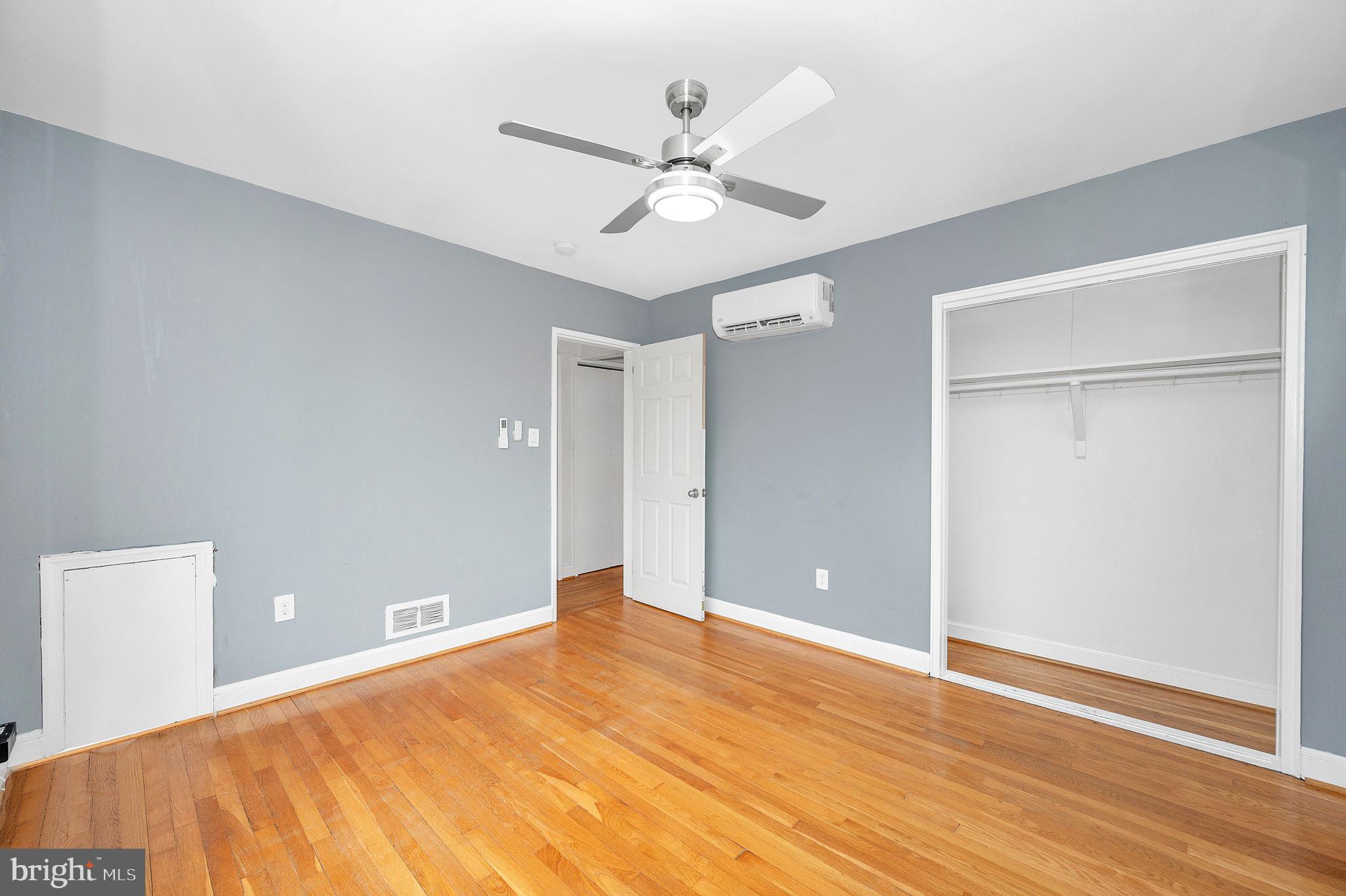 109 Webster Street Northeast Washington, DC 20011 - Photo 5 of 35 a view of a room with wooden floor and a ceiling fan