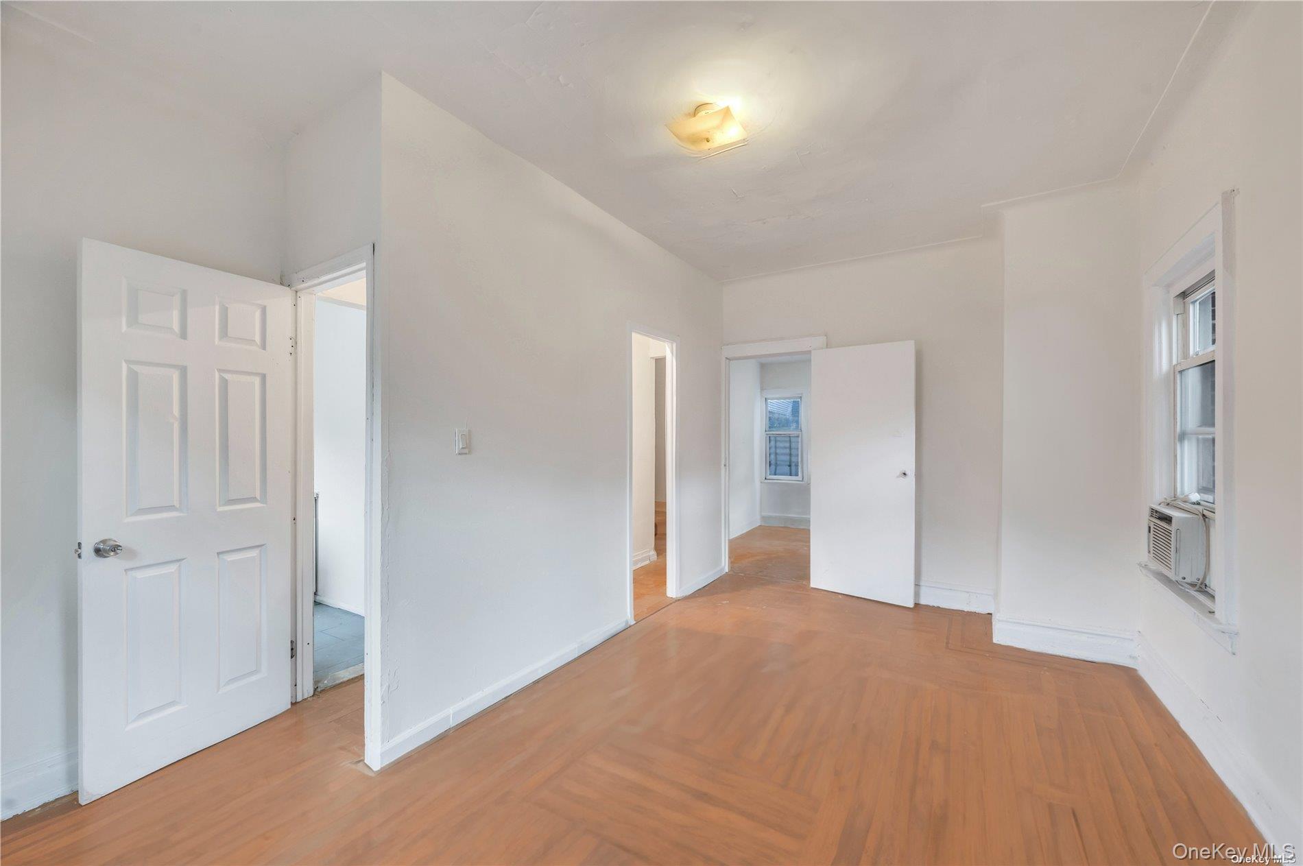 37-58 79th Street Queens, NY 11372 - Photo 12 of 28 a big room with wooden floor and bathroom view