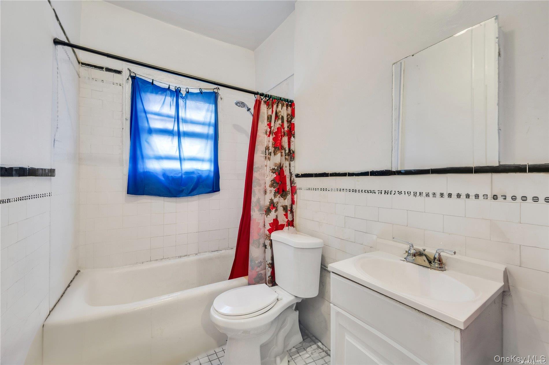 37-58 79th Street Queens, NY 11372 - Photo 18 of 28 a bathroom with a sink toilet and shower