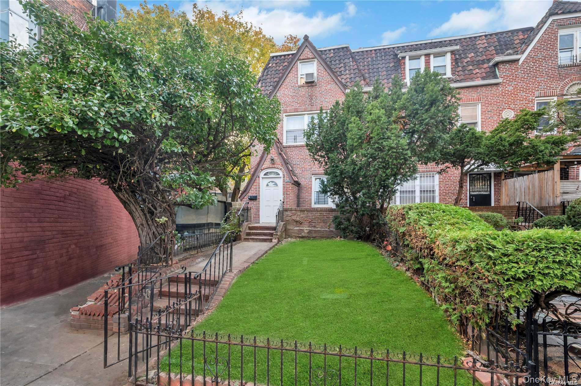 37-58 79th Street Queens, NY 11372 - Photo 2 of 28 a balcony with table and chairs and a yard