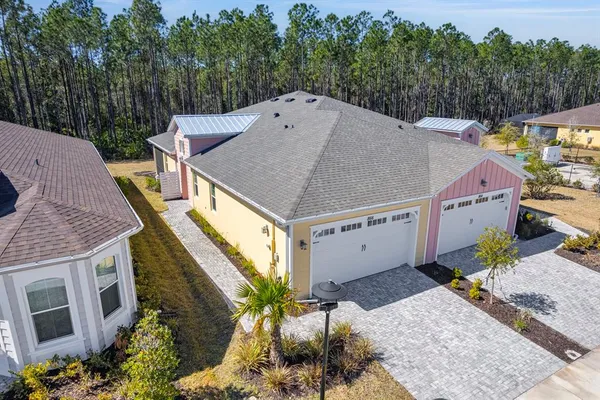 a aerial view of a house with a yard