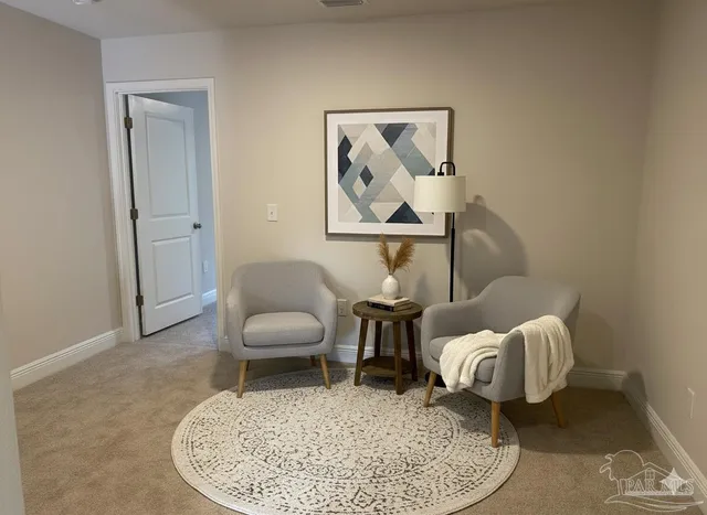 a bedroom with a bed mirror and window