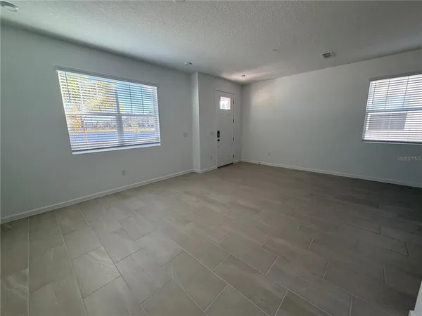 a white toilet sitting next to a shower