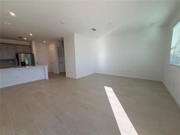 a white toilet sitting next to a white sink