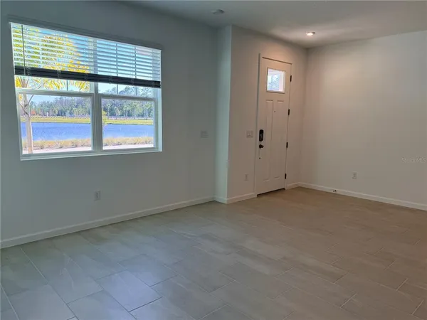 a bathroom with a double vanity sink a toilet and a mirror