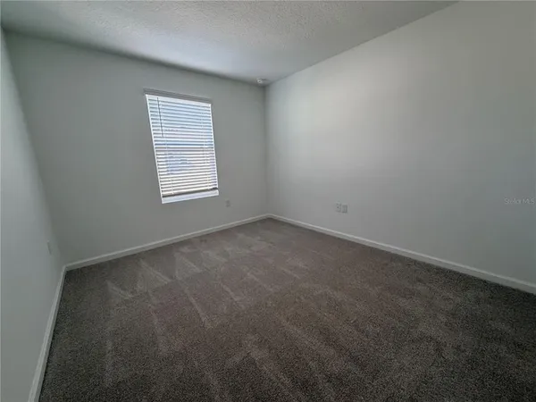 a view of a hallway with a white walls