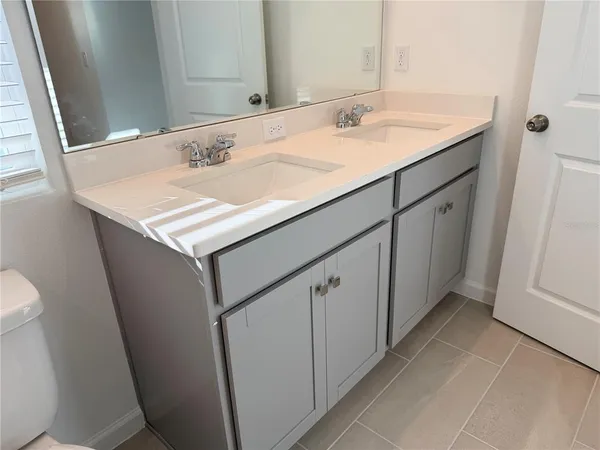 an empty room with a empty space and windows