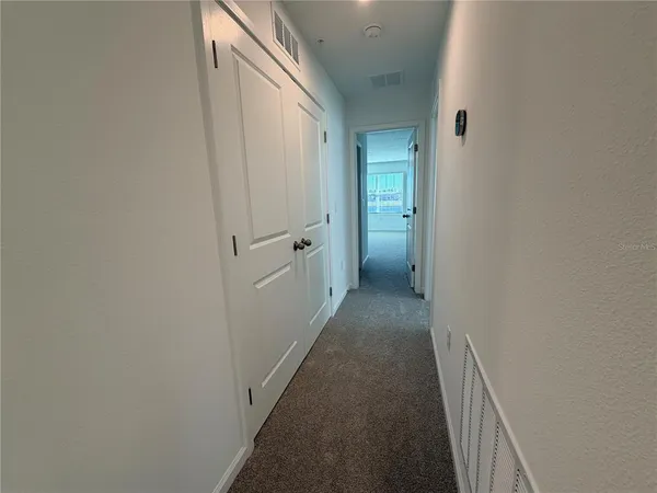 a bathroom with a shower and a sink