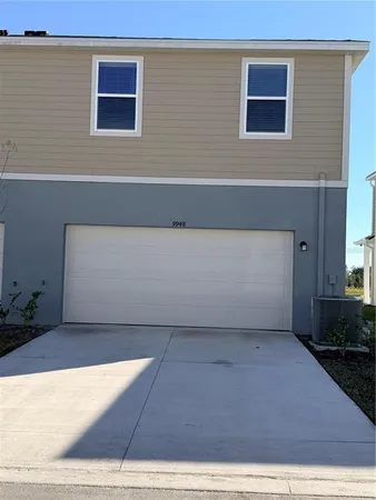 a view of a backyard with plants and a bench
