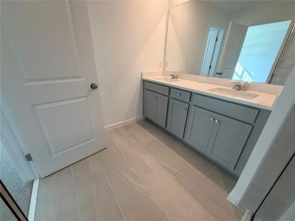 a view of a chairs and table in patio