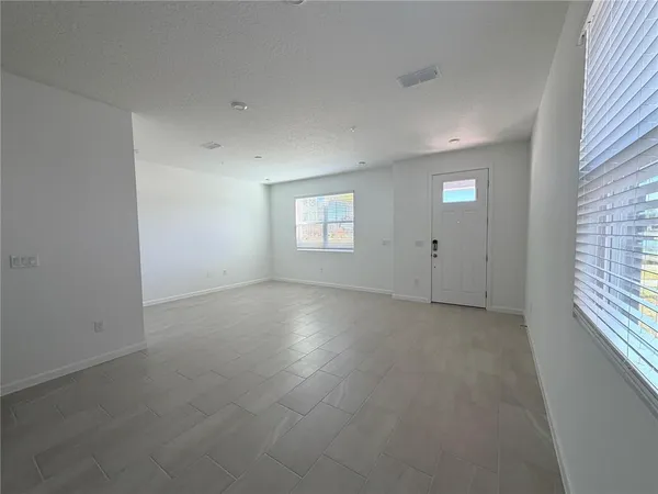 a kitchen with sink and cabinets