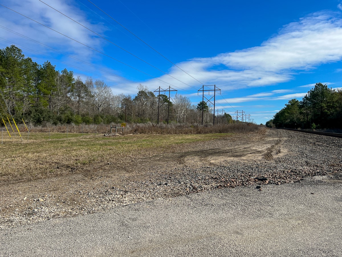 0 Joe Allen Road Kountze, TX 77625 - Photo 2 of 4 a view of a field with trees in background