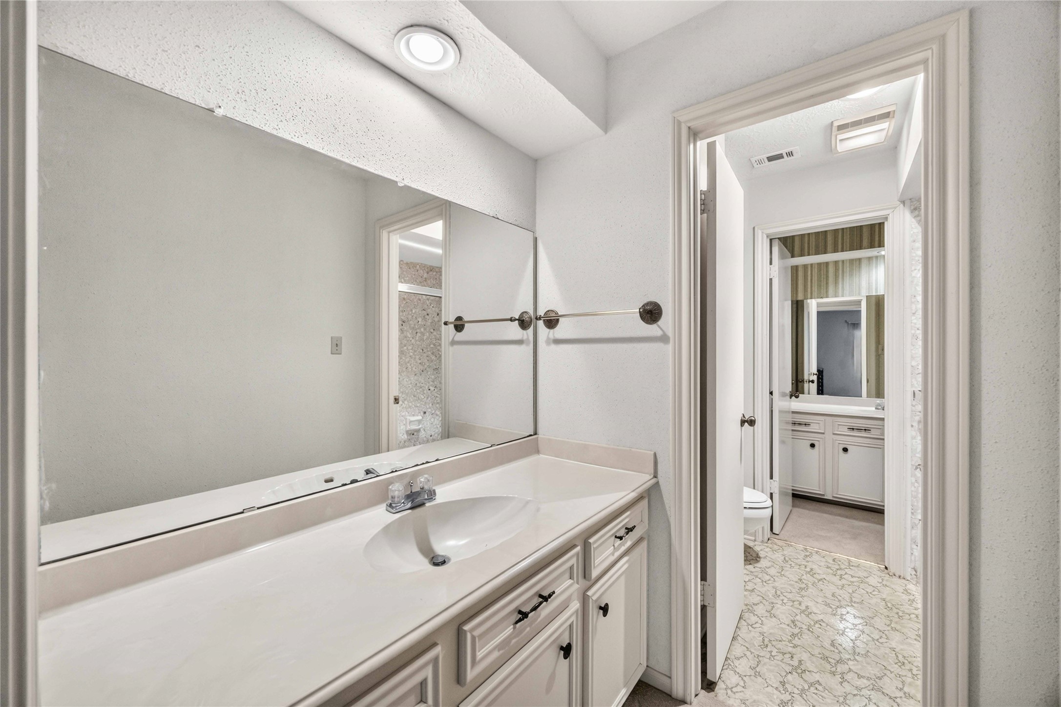6302 Meadowtrace Drive Spring, TX 77389 - Photo 21 of 35 Bedroom 2 includes a private sink and vanity area with access to the shared full bath between Bedrooms 2 and 3.