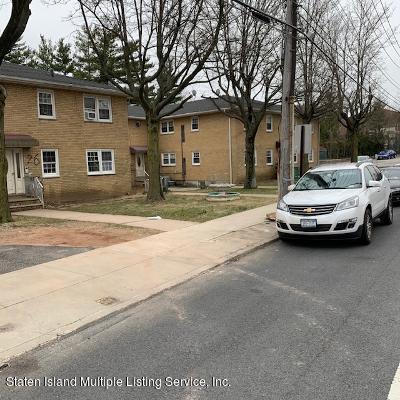 26 Narrows Road South Staten Island, NY 10305 - Photo 3 of 7 a car parked in front of white house