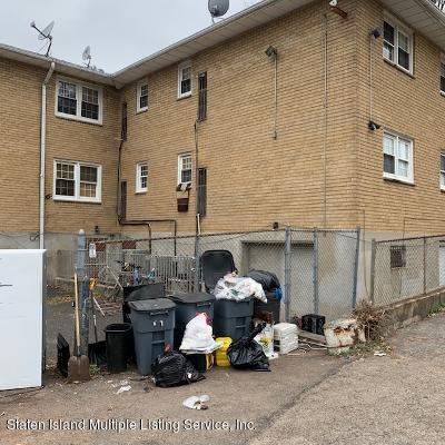 26 Narrows Road South Staten Island, NY 10305 - Photo 6 of 7 a couple of cars parked in front of a house