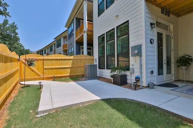 a view of a house with backyard sitting area and porch