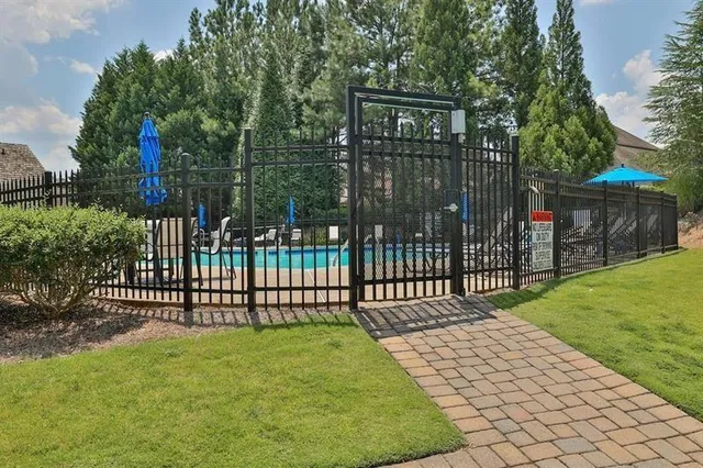 a view of a wrought iron fences in front of house