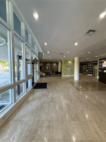 a view of an empty room with furniture