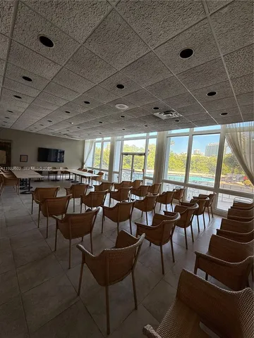 a group of people sitting at tables in a room