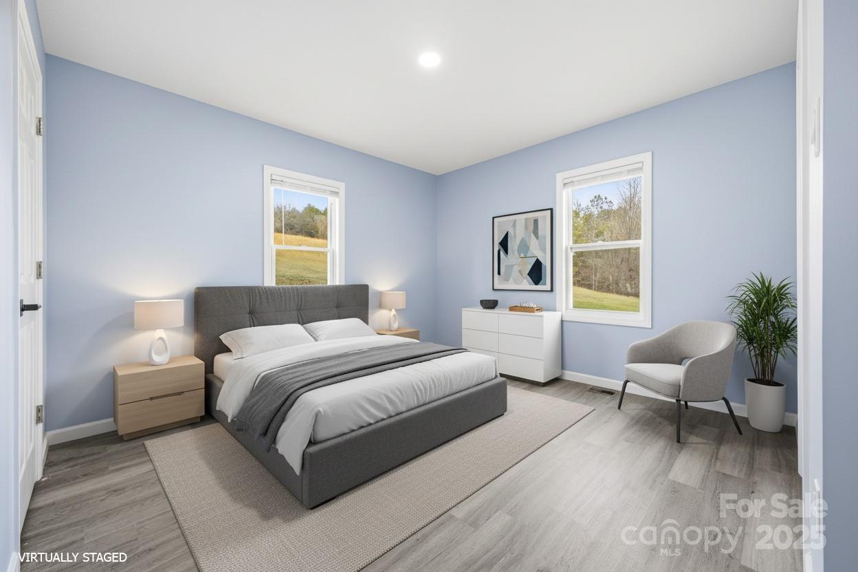 349 Gorman Bridge Road Asheville, NC 28806 - Photo 11 of 39 a bedroom with a bed and a large window