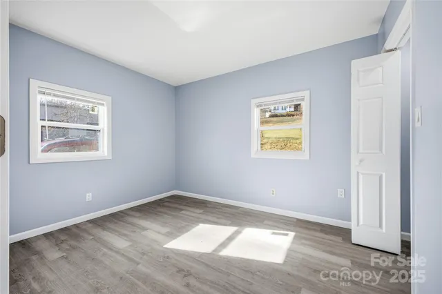 a view of an empty room with a window