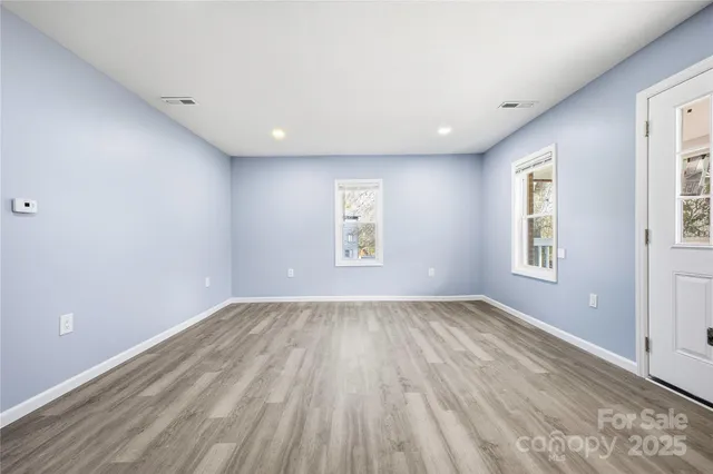 a view of an empty room and window