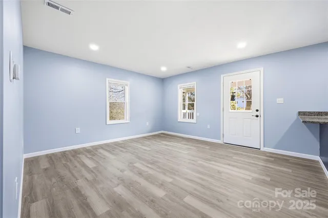 a view of an empty room with a window