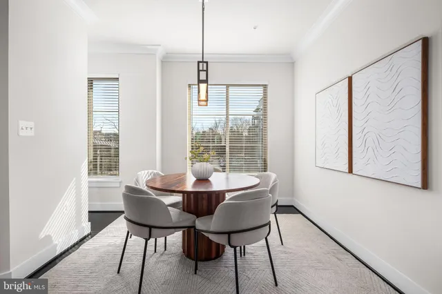 a view of a dining room with furniture window and outside view