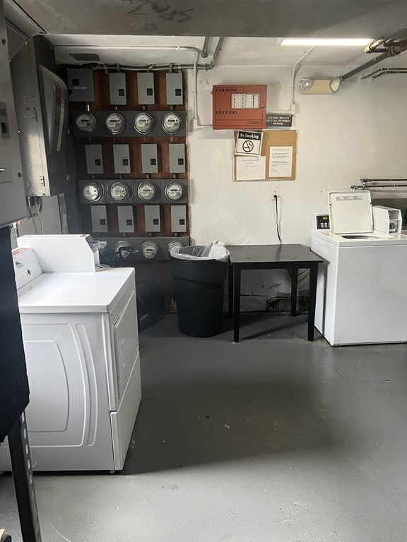 39 Carey Avenue, Unit 5 Watertown, MA 02472 - Photo 11 of 12 a room with water heater and wooden cabinets