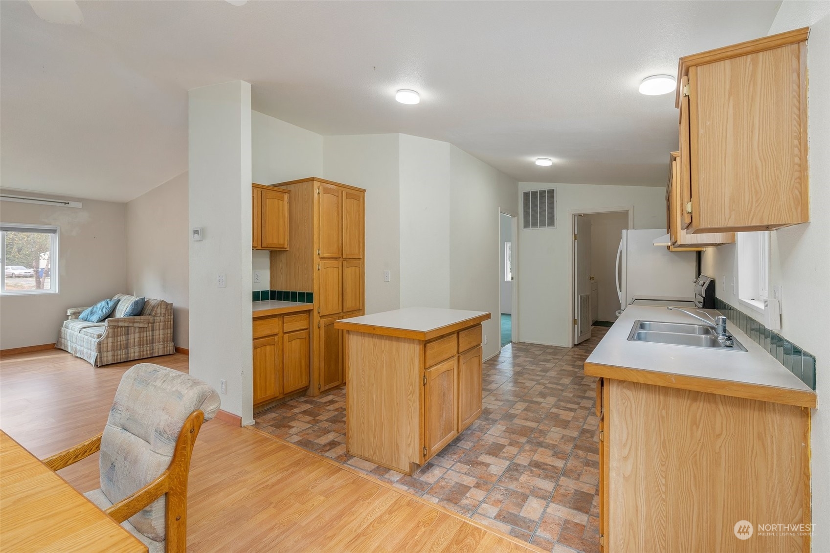 9210 192nd Lane Southwest Rochester, WA 98579 - Photo 8 of 40 a kitchen that has a sink and a stove in it