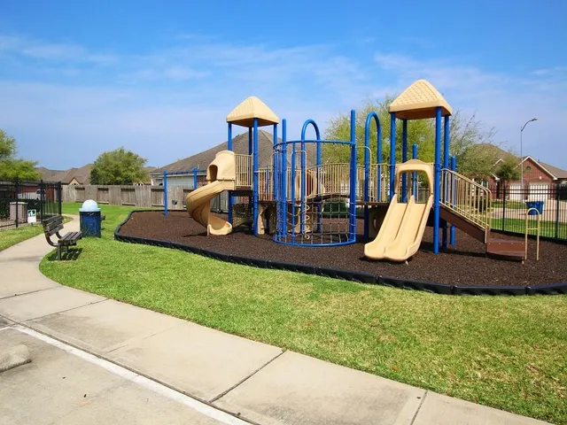a view of a swimming pool with a yard
