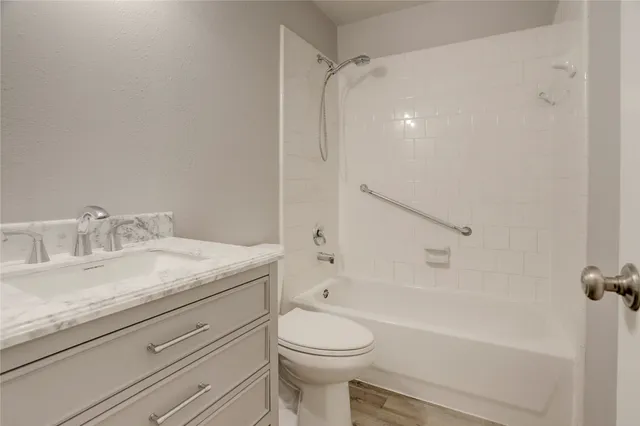 a spacious bathroom with a double vanity sink a mirror and a shower