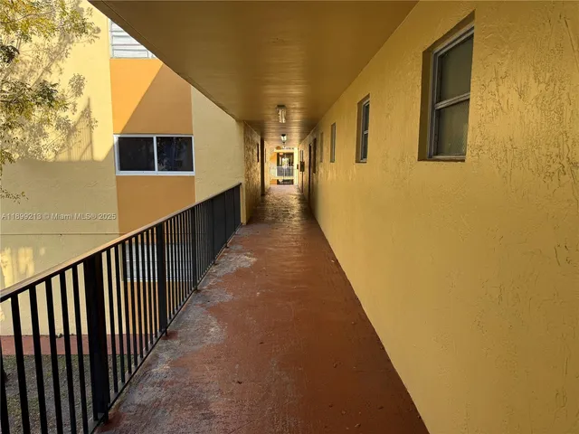 a kitchen with stainless steel appliances a refrigerator sink and cabinets
