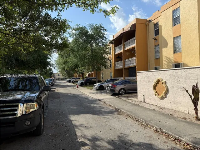 a view of a street with cars