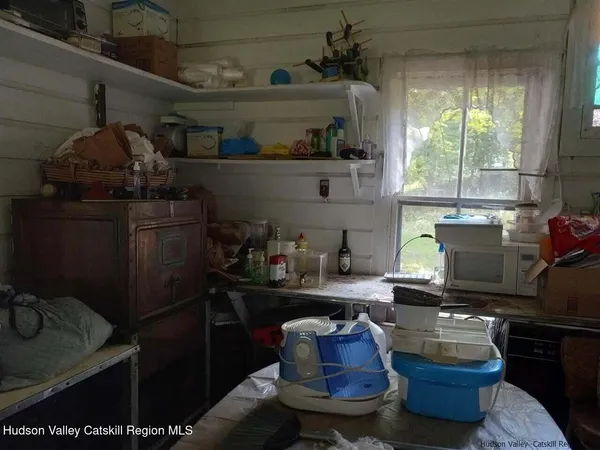 a kitchen with a sink a stove and a window