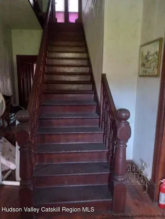 a view of gallery with wooden floor