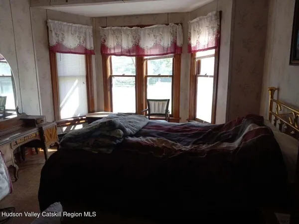 a view of a hallway with a elevator and a livingroom