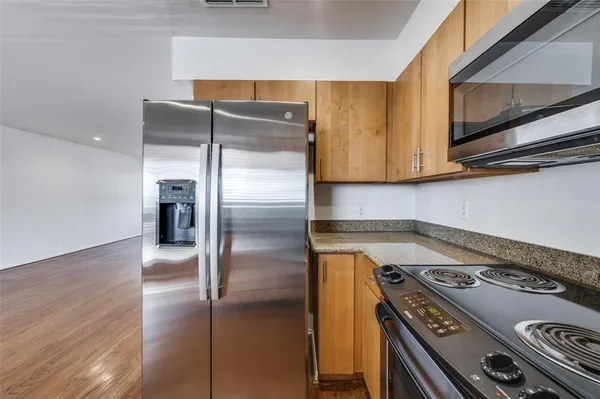 a kitchen with a stove and a microwave