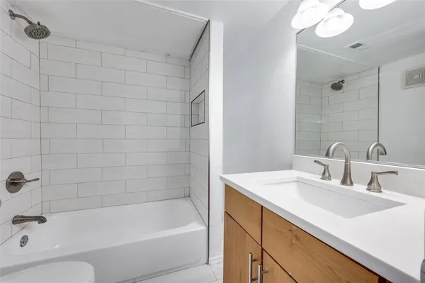 a bathroom with a sink and a bathtub