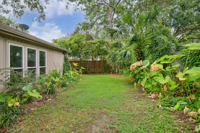 a view of a house with a backyard