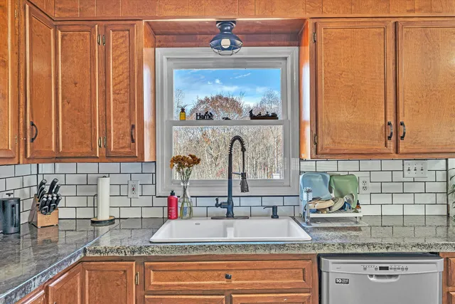 a bathroom with sink and mirror