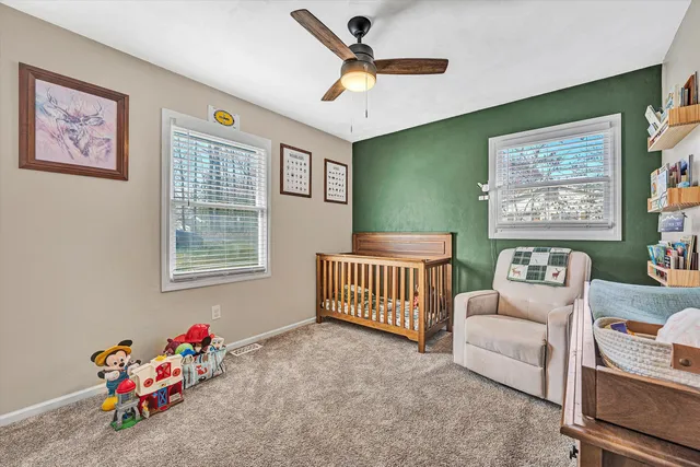 a bed room with furniture and a window