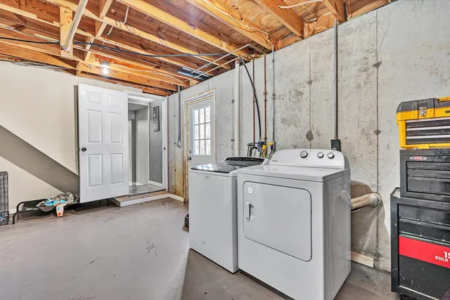 a view of a patio with iron fence