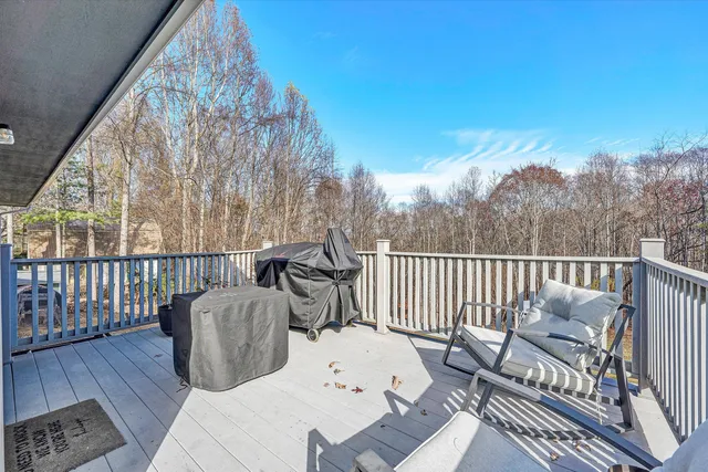 a view of outdoor space with deck and yard