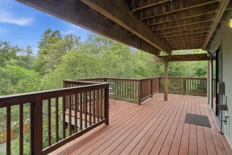 a view of balcony with wooden floor